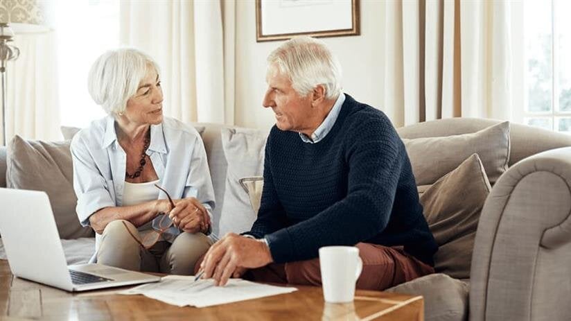 A man and woman sitting on a couch