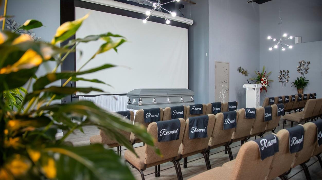 A room with chairs and a projector screen
