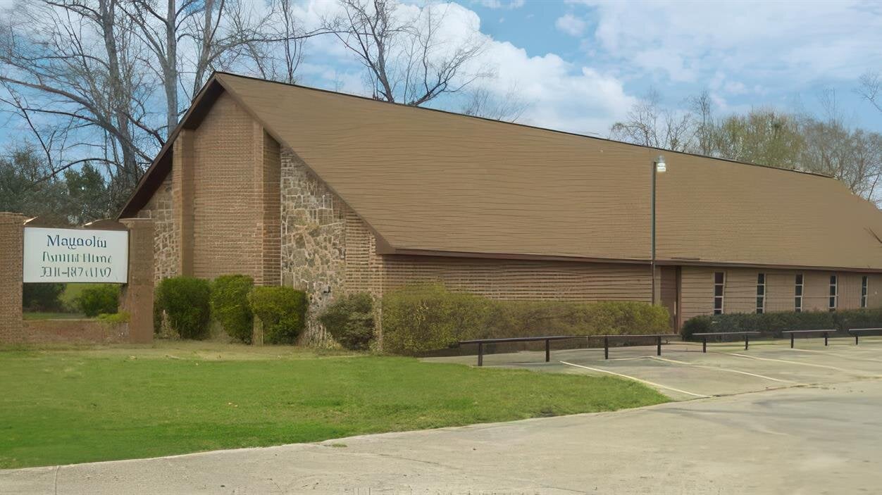 A building with a parking lot