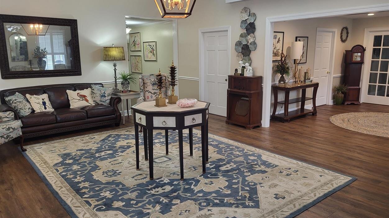 A living room with a couch and a table