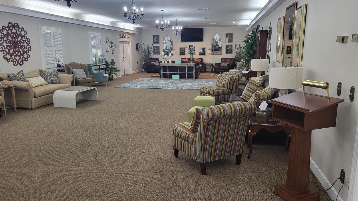 A room with many chairs and a table