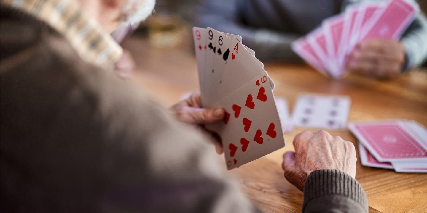 A man holding a deck of cards