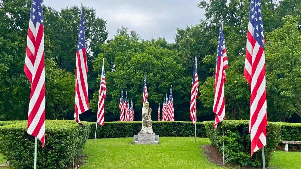 A group of flags in a garden