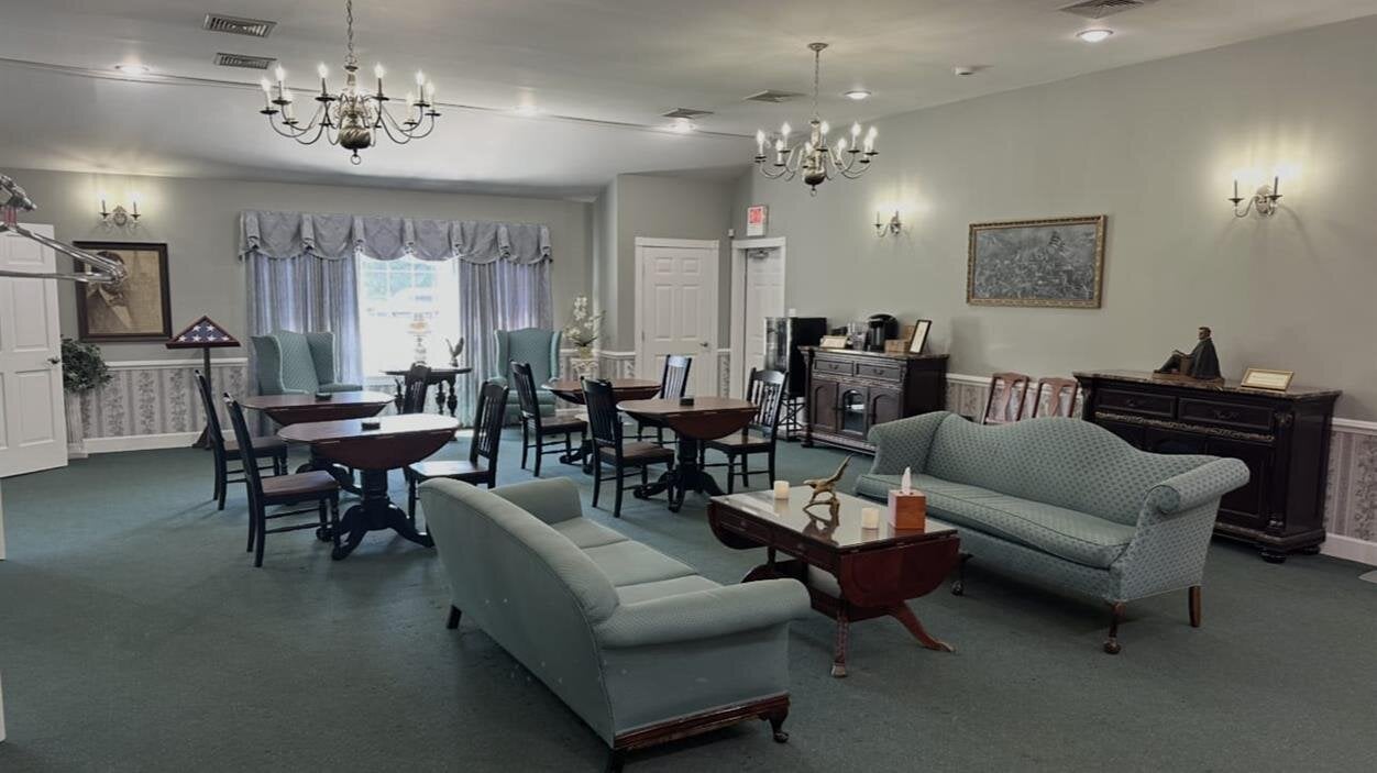 A room with a piano and couches
