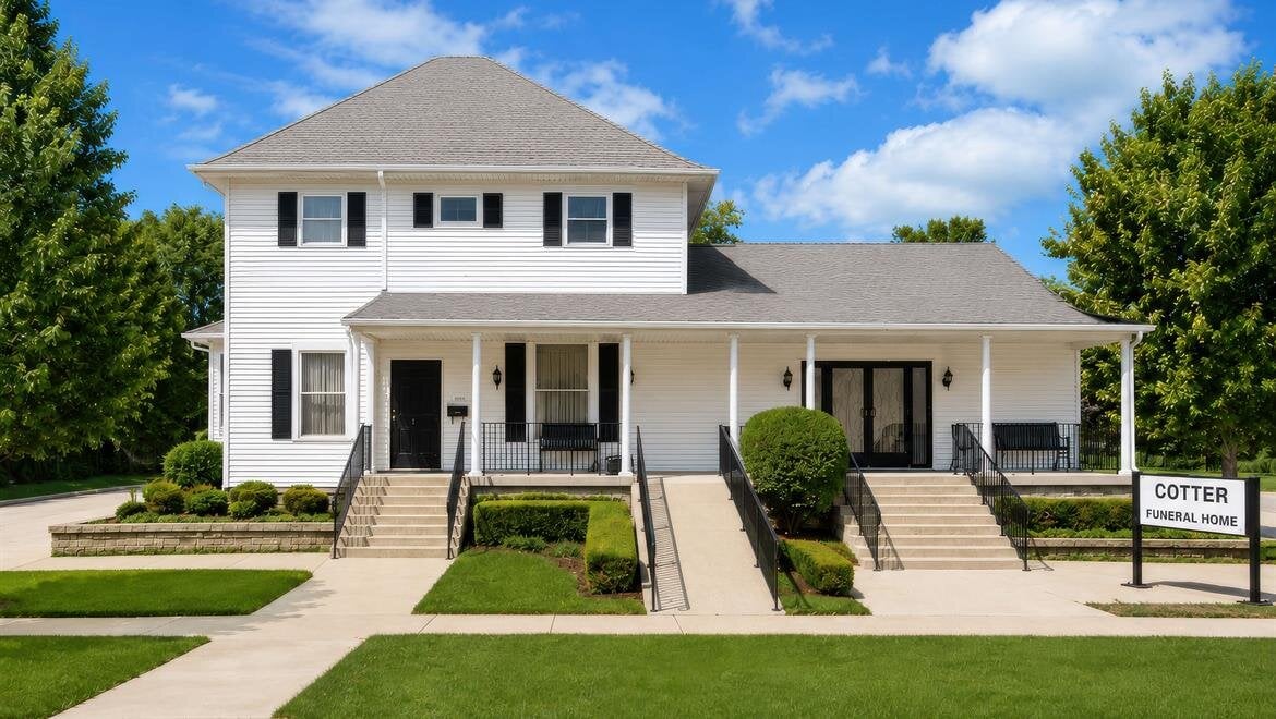 A white house with stairs and stairs leading to the front