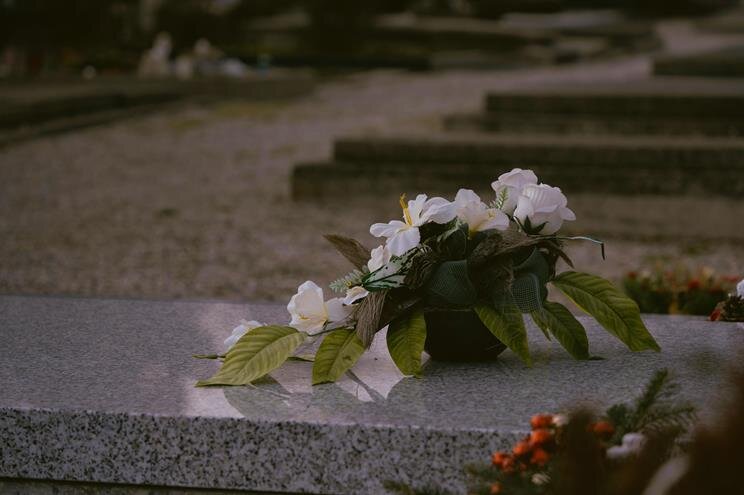 A close-up of a flower arrangement on a granite slab