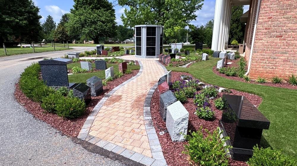 A stone walkway in front of a building