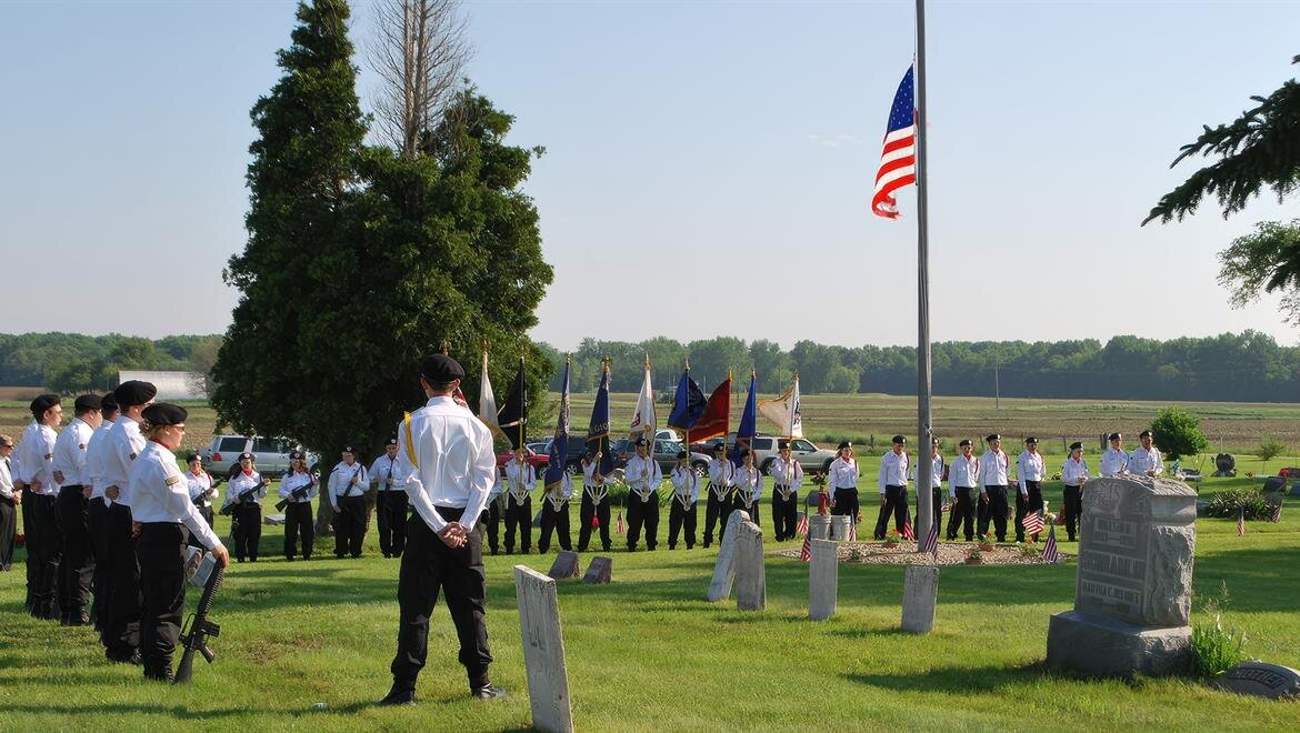 A group of people standing in a field