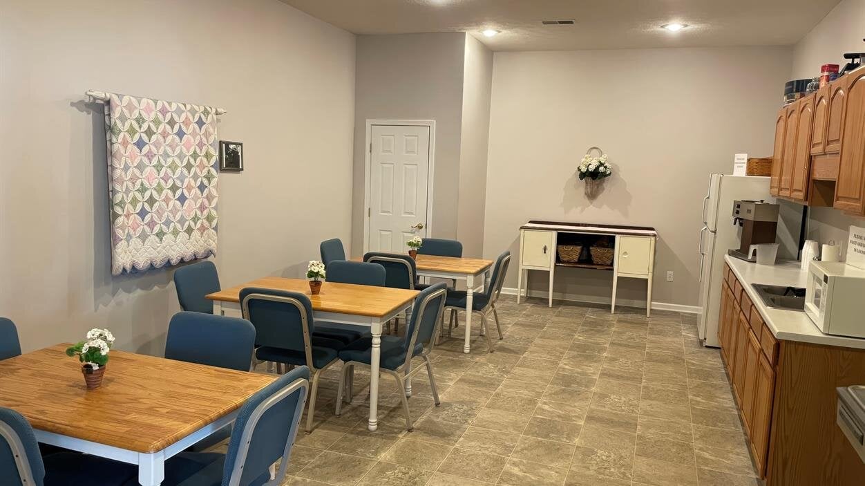 A room with tables and chairs