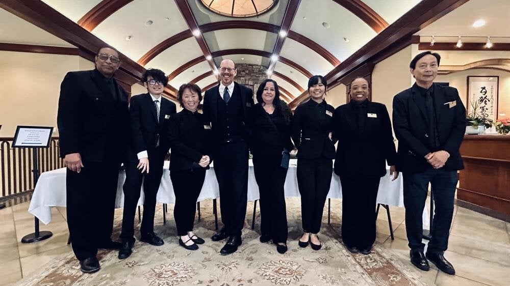 A group of people standing in a room