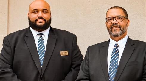 A couple of men in suits