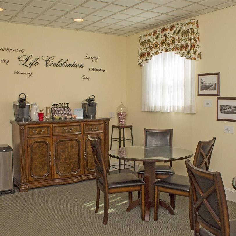 A room with a table and chairs