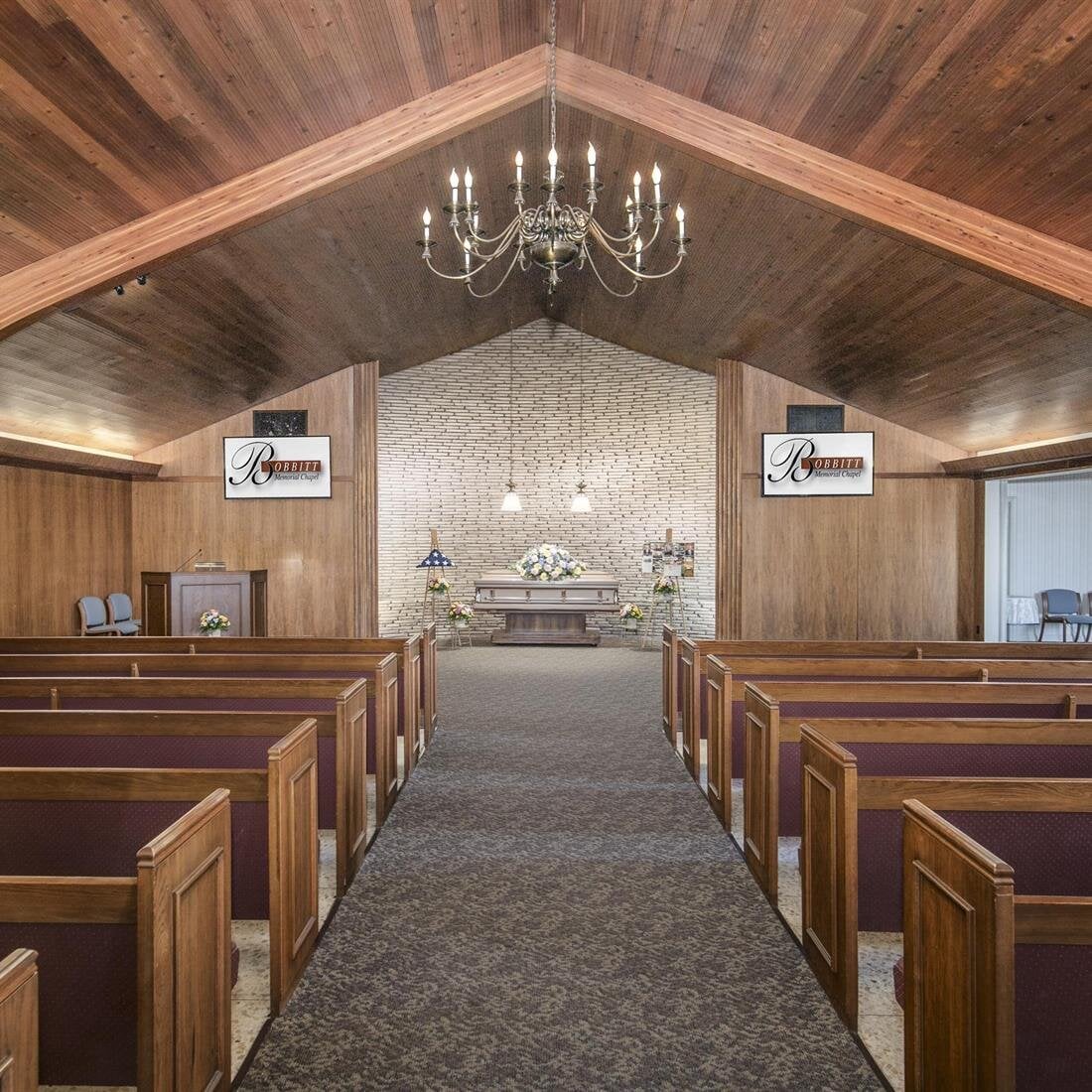 A church with pews and a chandelier