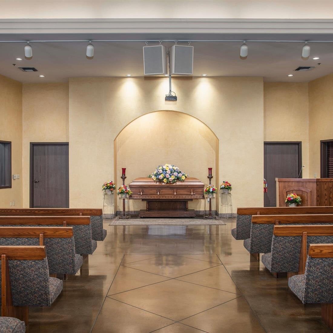 A room with pews and chairs