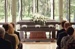 a gathering of people attending a funeral service in Bradenton, FL