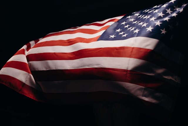 United States flag waving in the wind, representing veteran funeral honors in Albany, NY