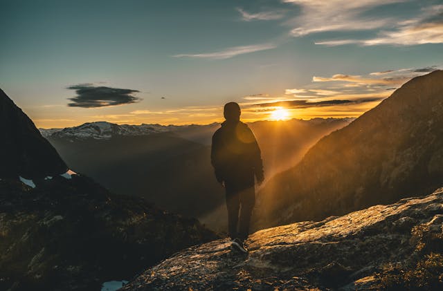 Plan Ahead services at Schenectady, NY funeral home with mountain sunrise reflection