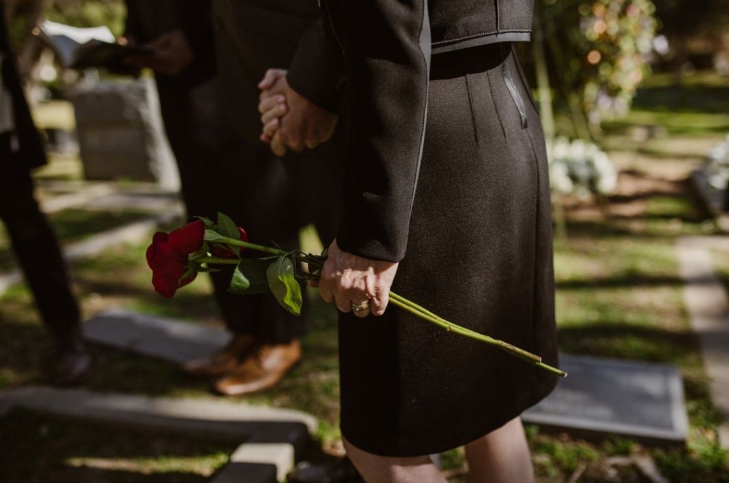 Red roses at a graveside funeral service in DeLand, FL