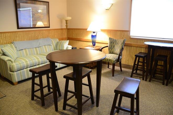A room with a table and chairs