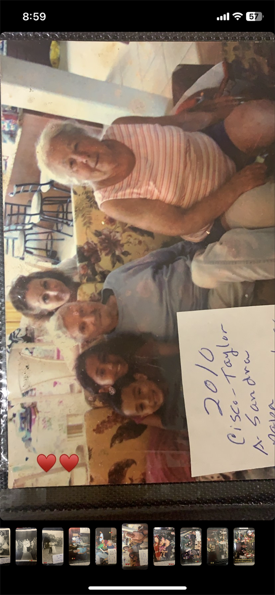 A joyful family reunion captures multiple generations enjoying time together in a cozy setting.