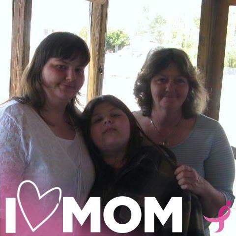 Three women stand together in a warm environment, showcasing family bonds and love.