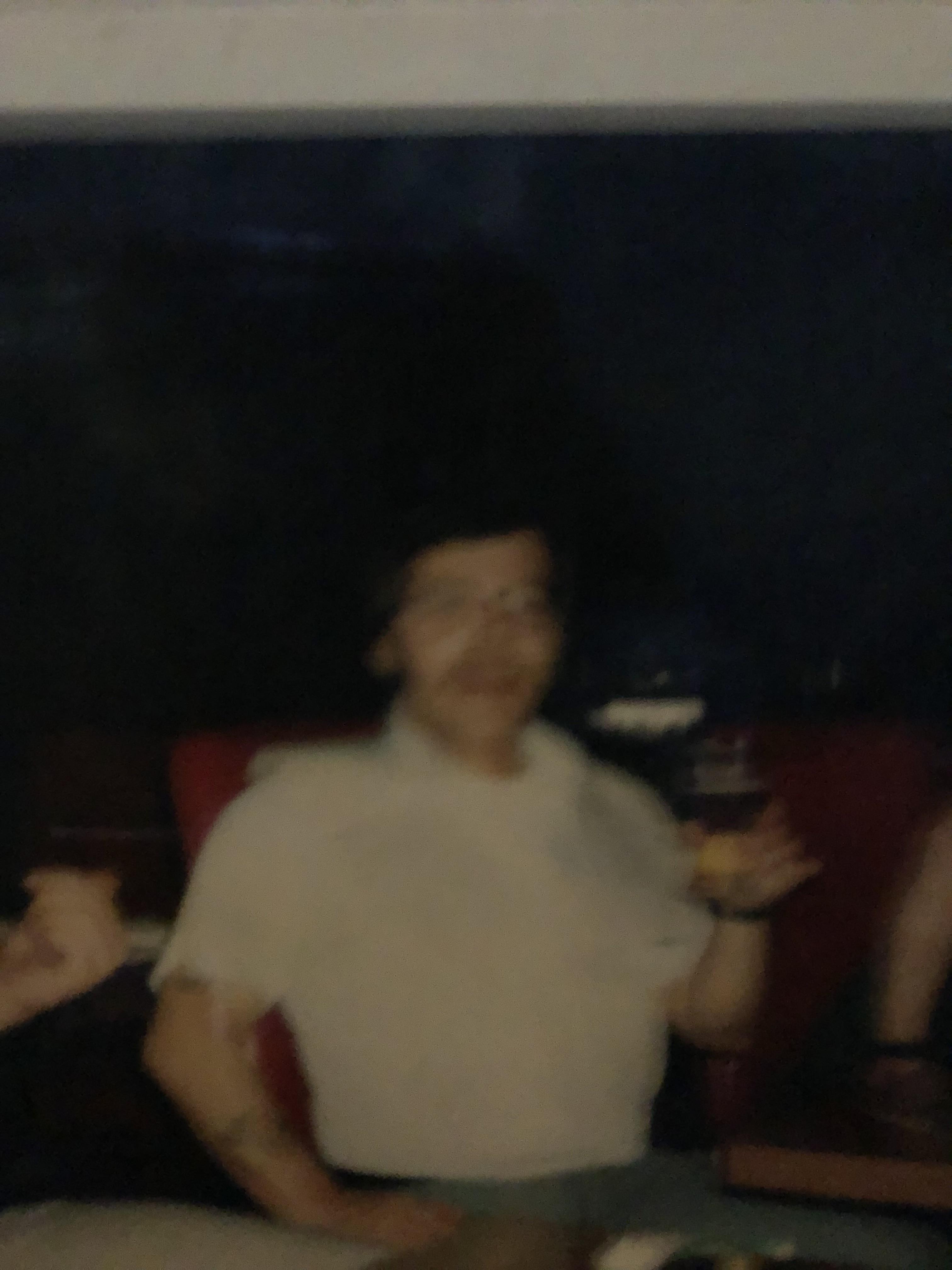 Friends gather in a cozy setting, enjoying drinks and conversation during a lively evening.