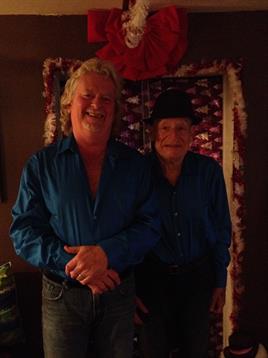 Two men standing in a room