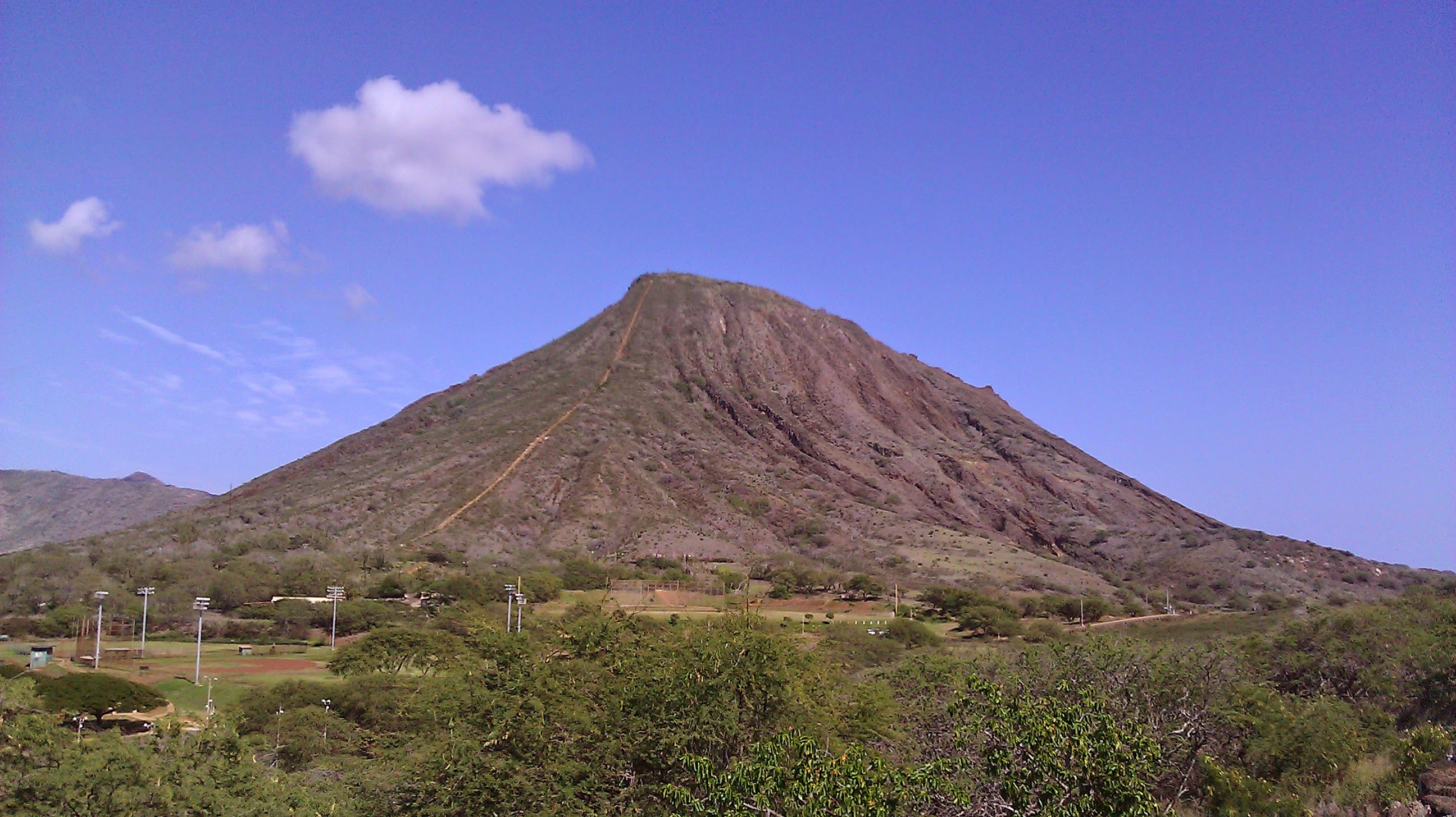 A mountain with a blue sky