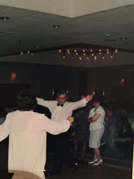 A man and woman dancing in a room