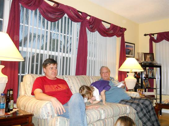 A man and a child sitting on a couch