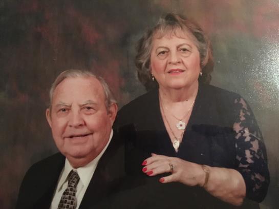 A man and woman posing for a picture