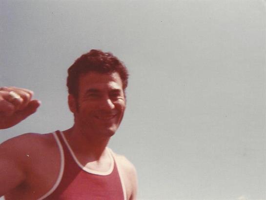 A man in a red tank top