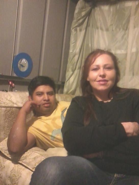 A man and woman sitting on a couch