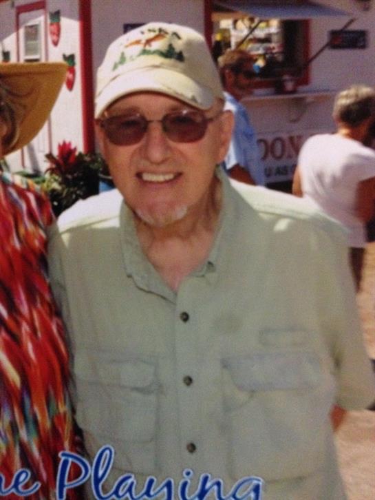 A man wearing a hat and sunglasses