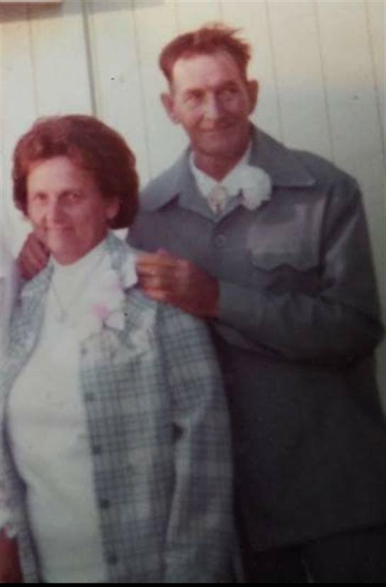 A man and woman posing for a picture
