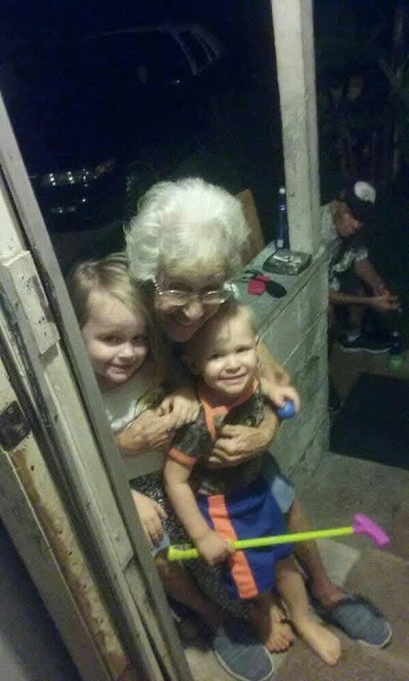 A woman and two children posing for a picture