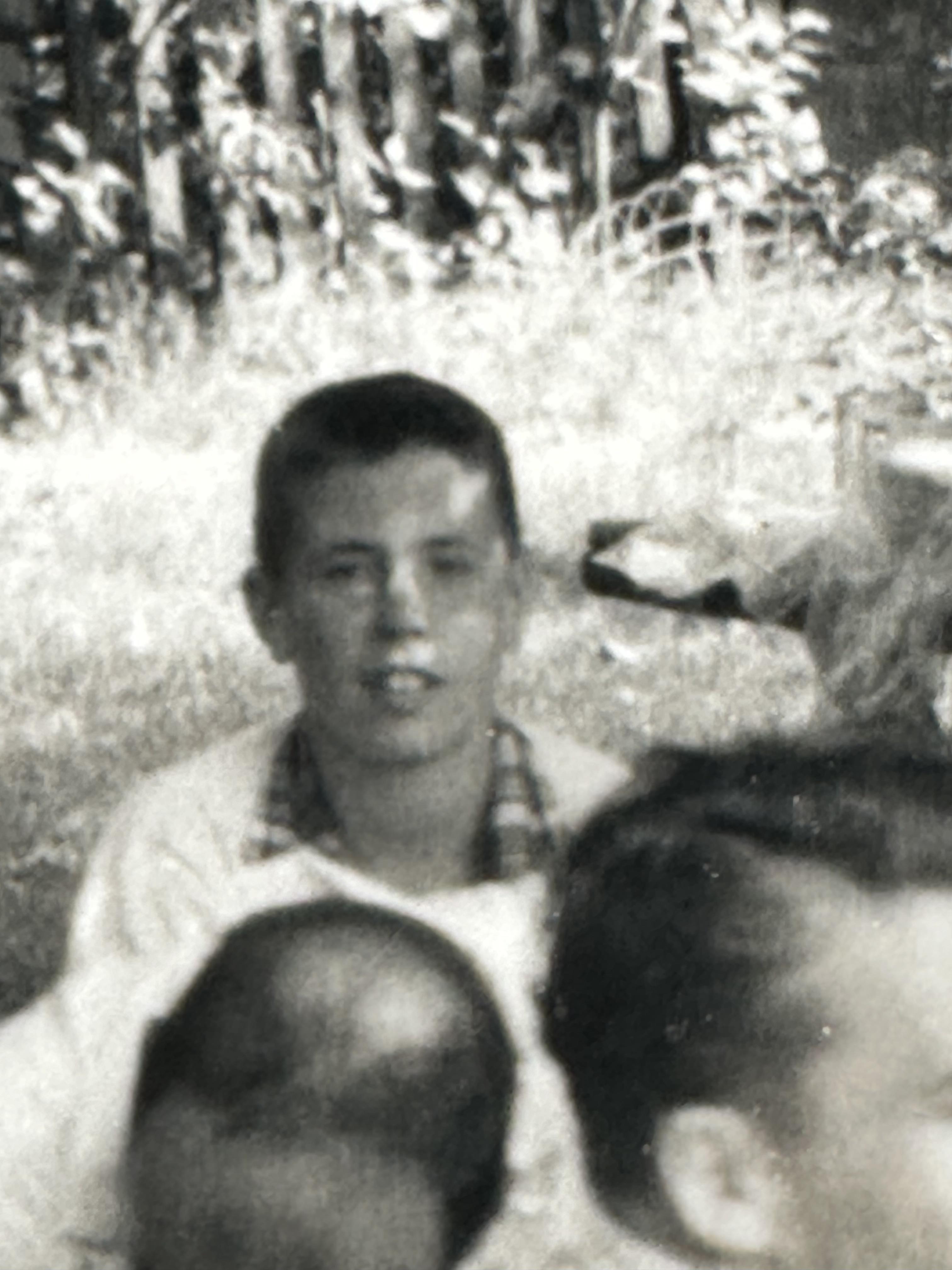 Children sit together in a park, sharing laughter and stories on a sunny afternoon.