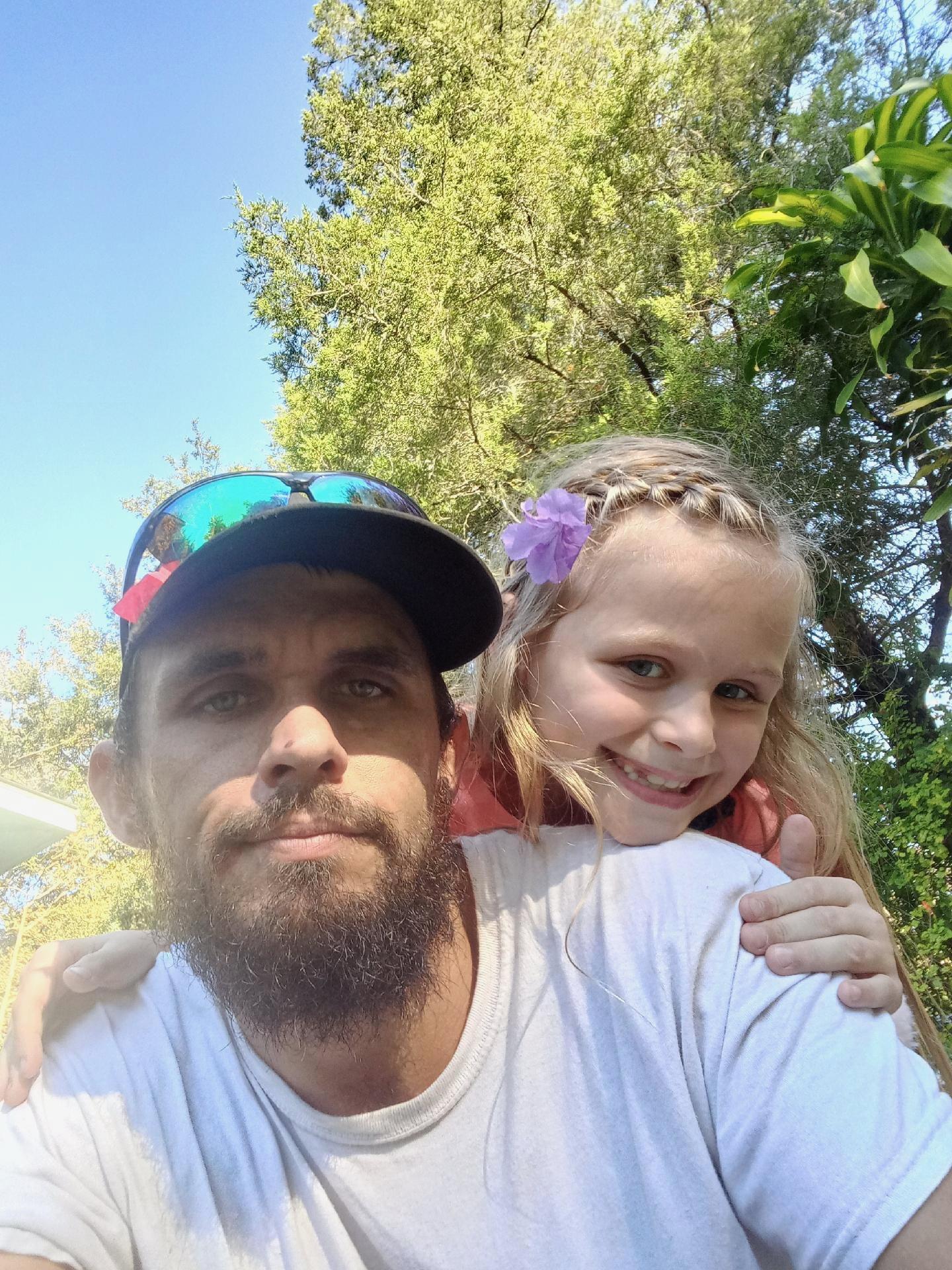 A man and girl taking a selfie