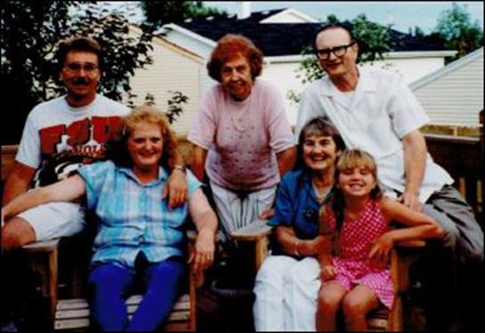 A joyful family shares a warm afternoon in their backyard, filled with love and connection.