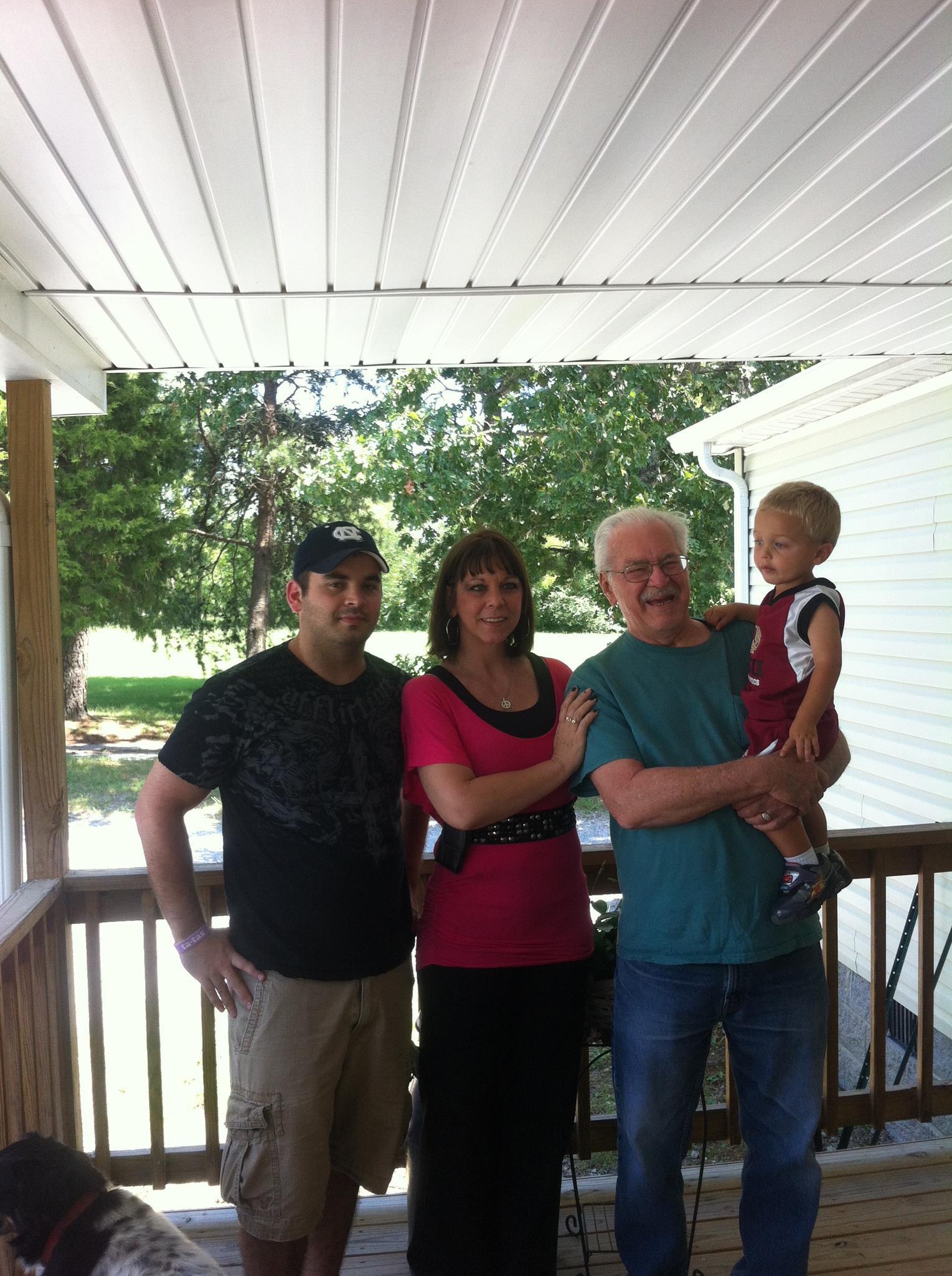 A group of people standing on a porch