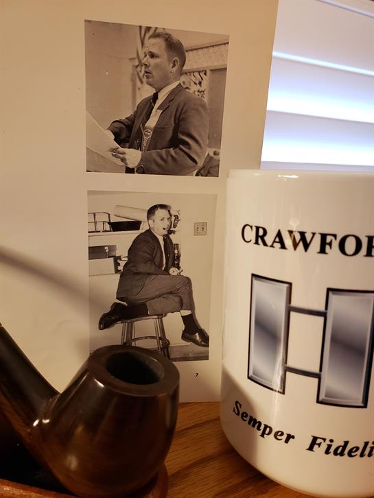 Classic portraits show men in suits, with a tobacco pipe and mug adding to the vintage aesthetic.