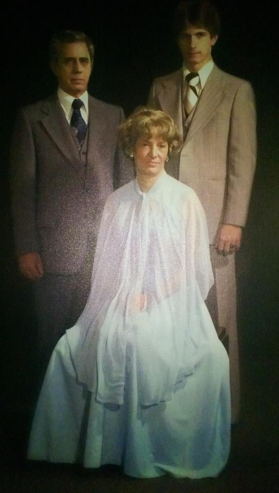 Family members pose together, highlighting fashion styles from the early 1900s.