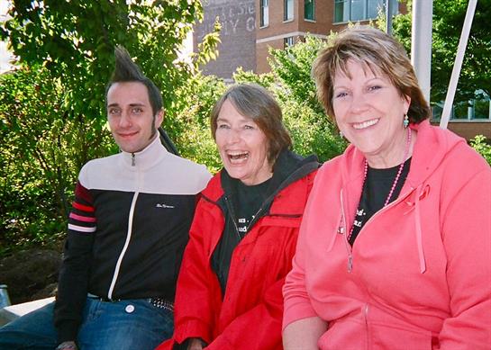 Friends gather in a park, sharing laughter and enjoying the pleasant spring weather.