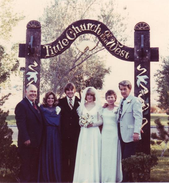Family and friends gather outside the Little Church of the West in Las Vegas after a wedding.