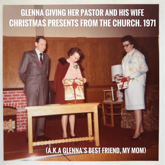 Glenna gives Christmas gifts to her pastor and his wife in a church setting in 1971.