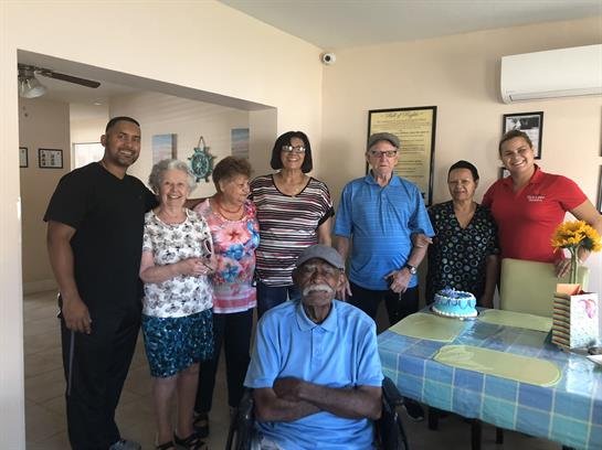 Relatives come together to celebrate a special birthday in a warm home atmosphere.