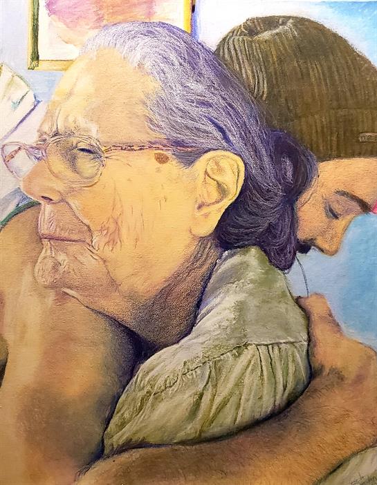 A young man hugs an elderly woman, conveying warmth and affection in a cozy room.