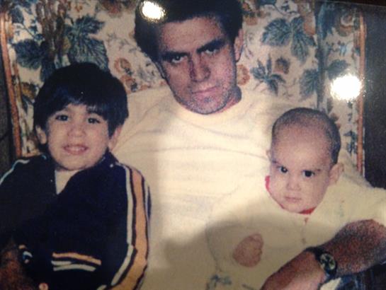 A man and two children posing for a picture