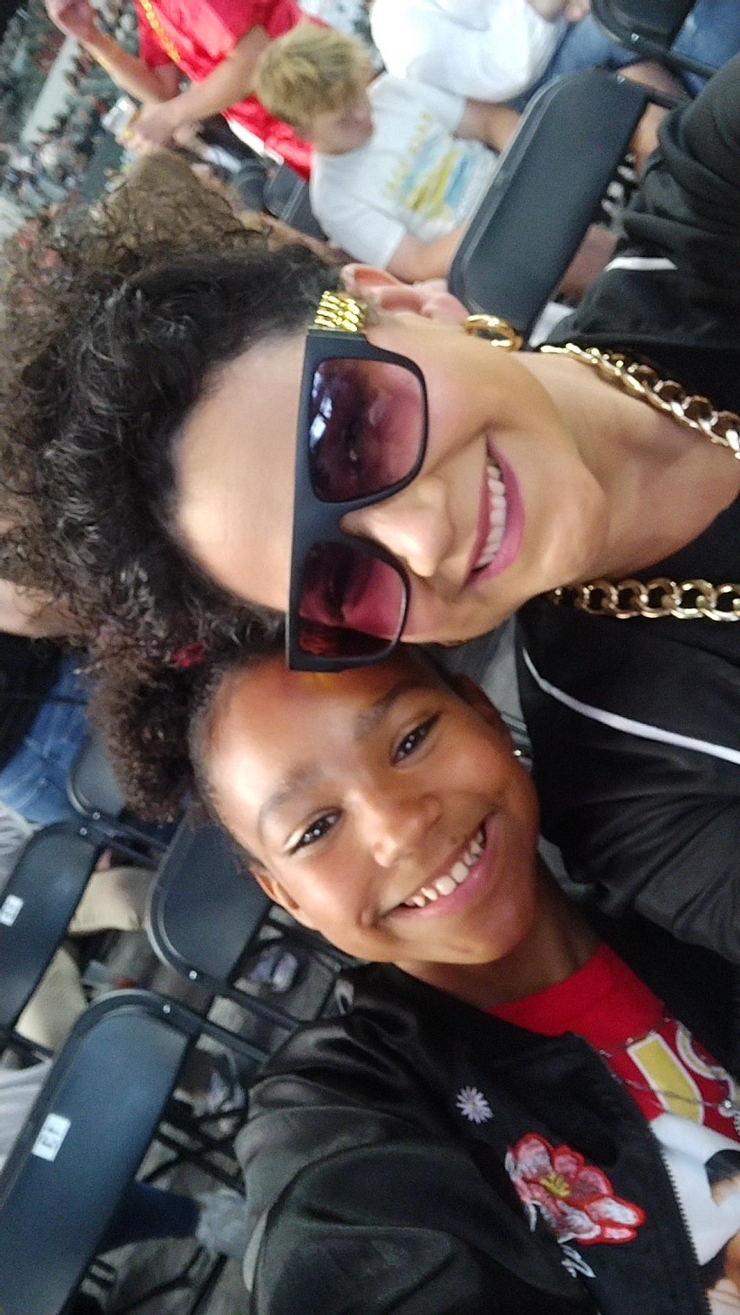A woman and a girl smiling