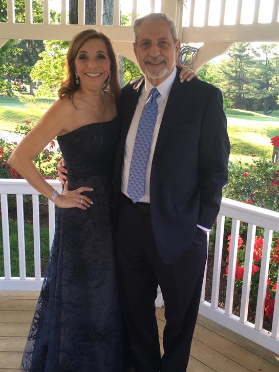 A man and woman posing for a picture